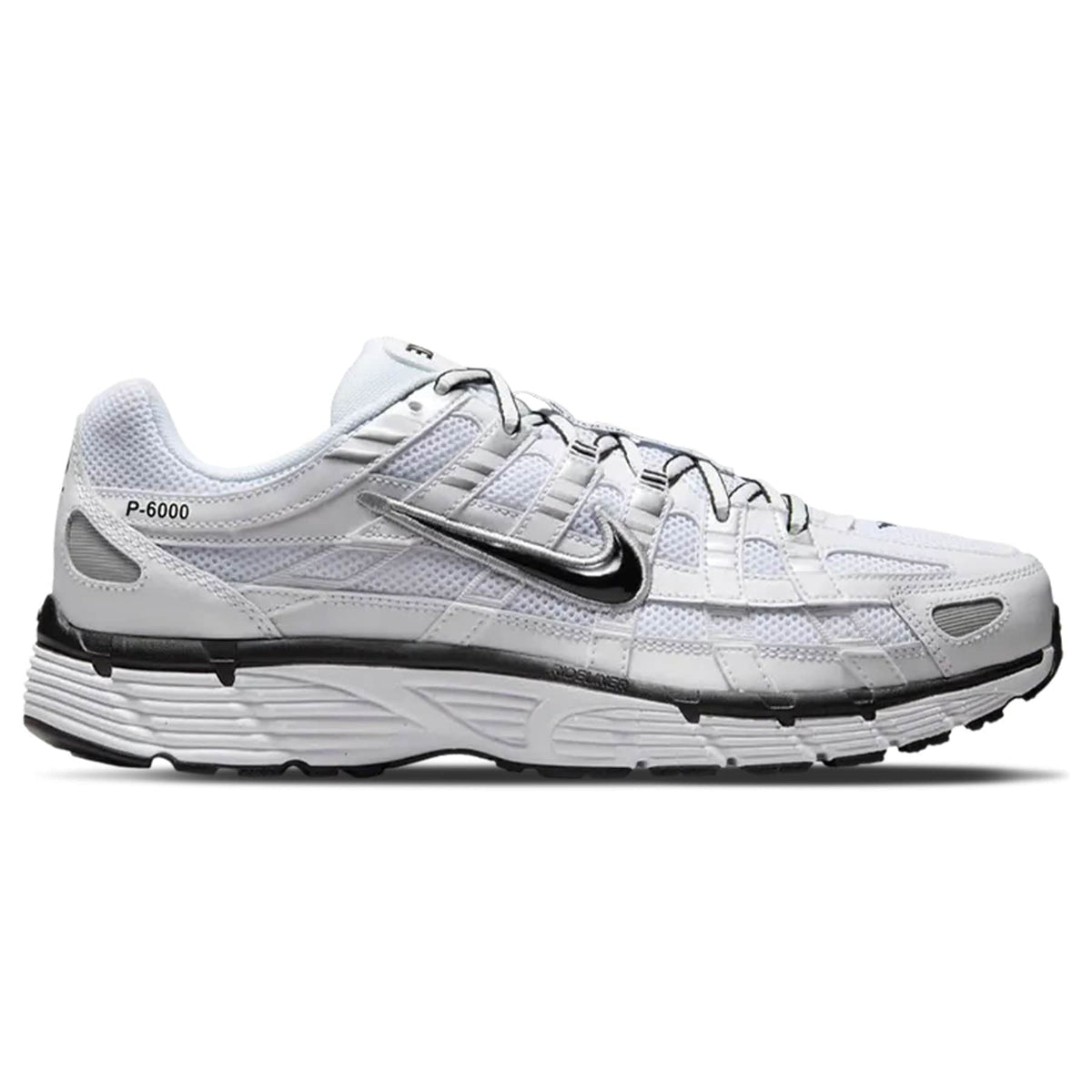 White Nike trainers with metallic silver panels, black outsole, and P-6000 branding