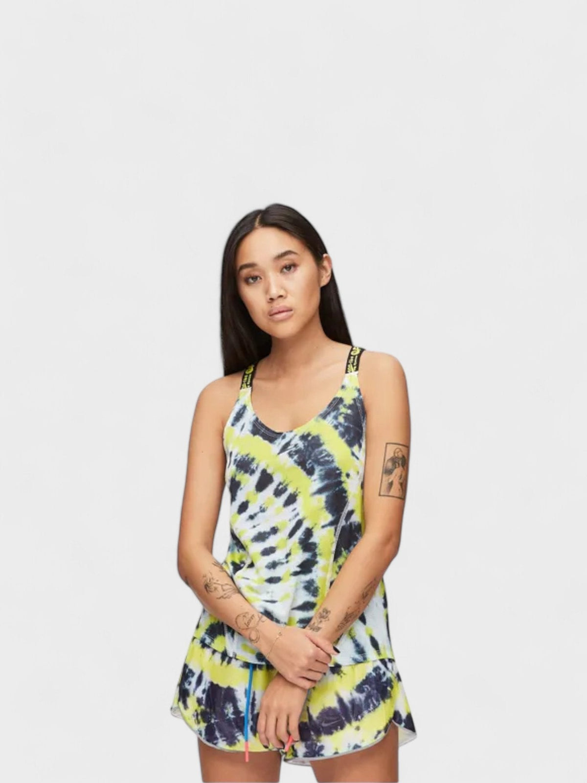 Women's Nike tank top with yellow and black tie-dye print, scoop neckline and hem