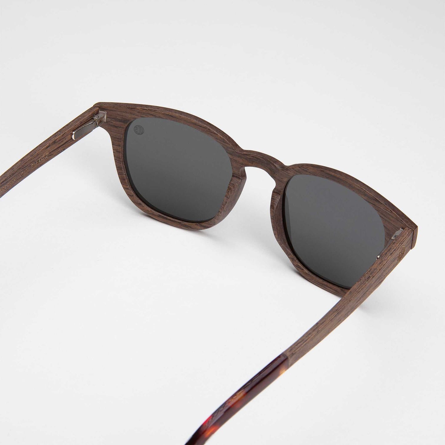 Walnut sunglasses with dark lenses and tortoise temple accents
