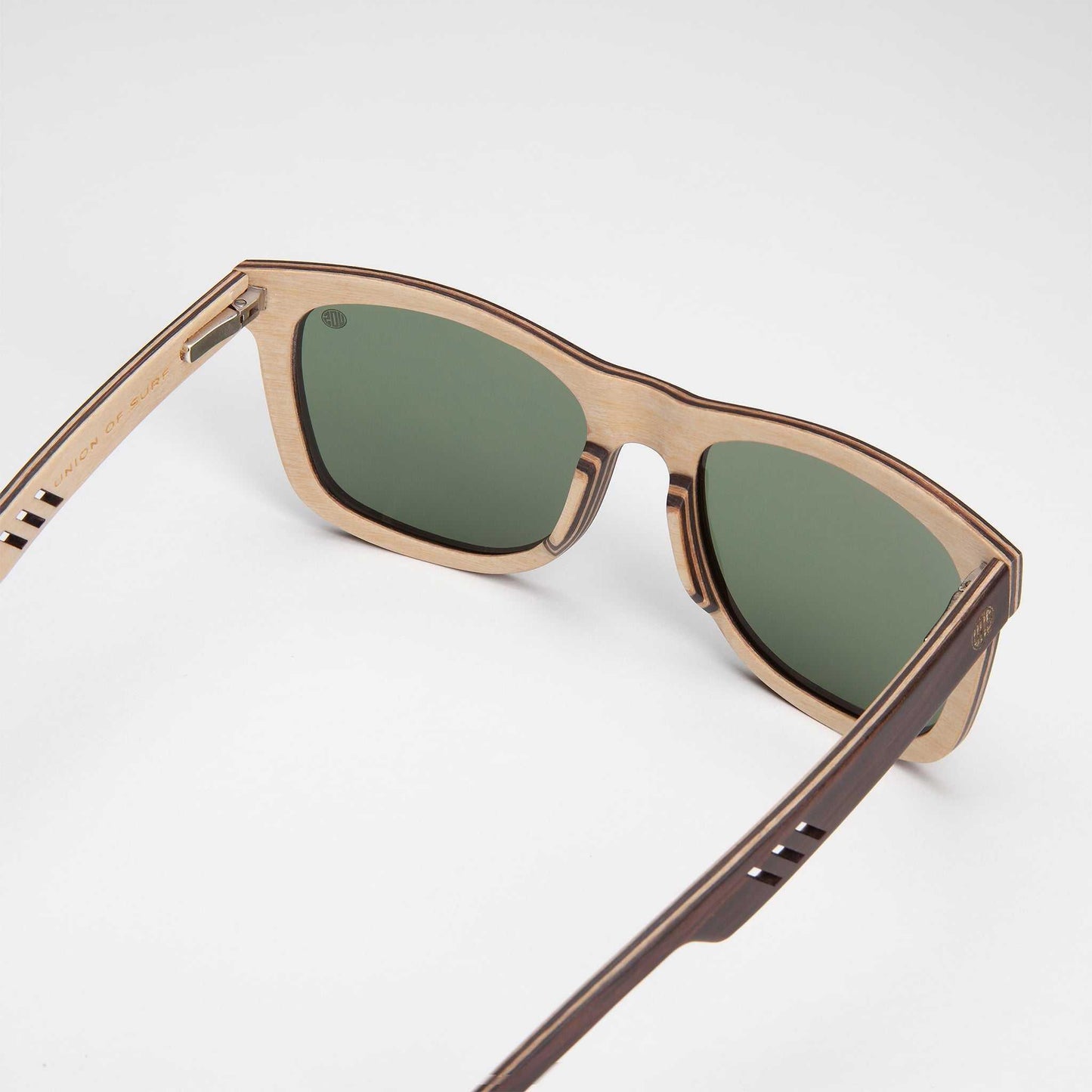Tan and dark brown sunglasses with green lenses and squared shape