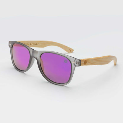 Smoke gray cat-eye sunglasses with purple mirrored lenses and bamboo-look arms