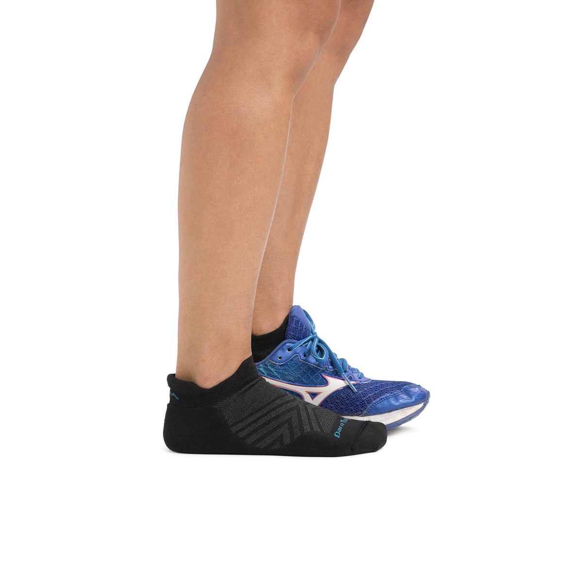No-show merino running socks on foot, dark color with textured stripe pattern