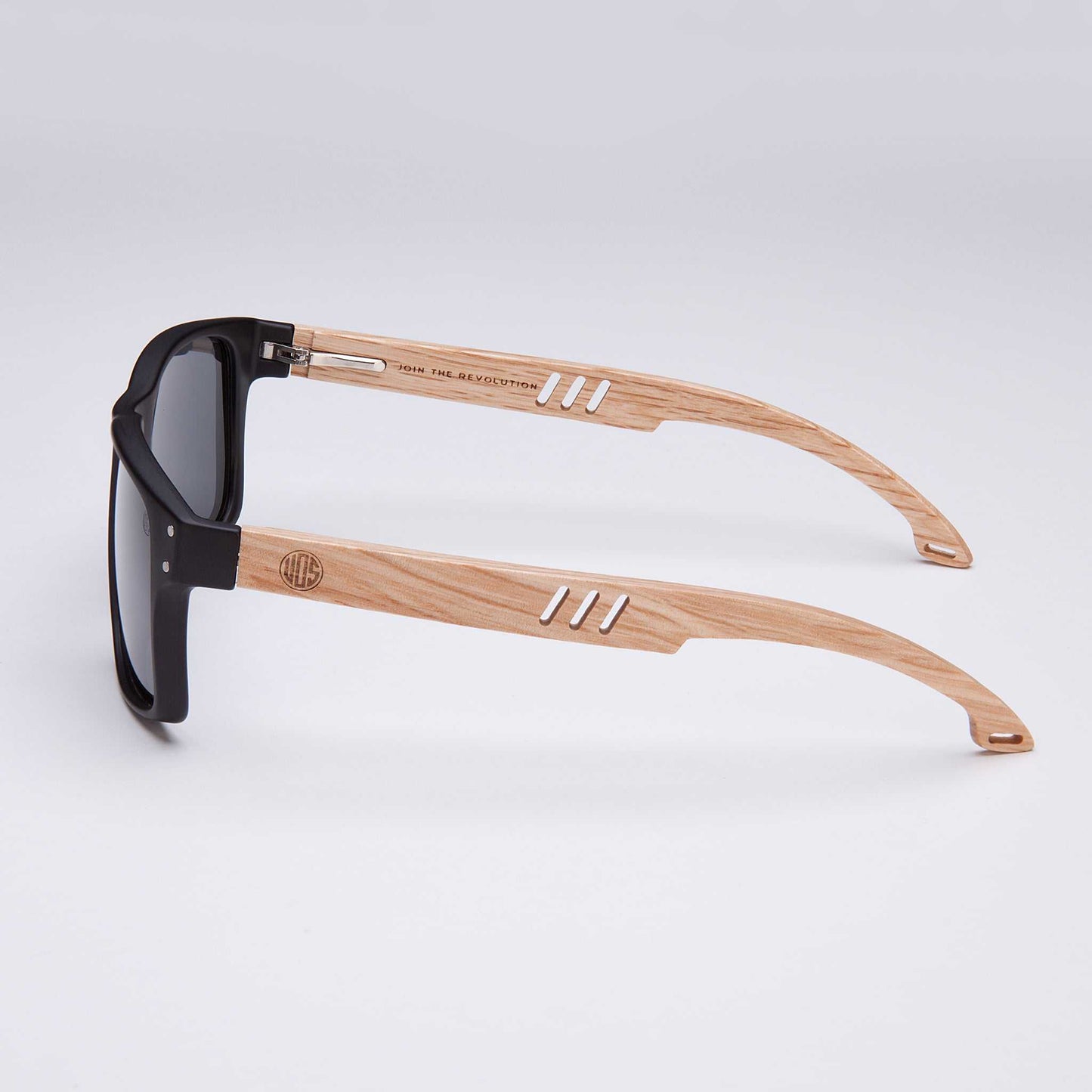 Polarised sunglasses side view with dark lenses, black frame, and light wood arms