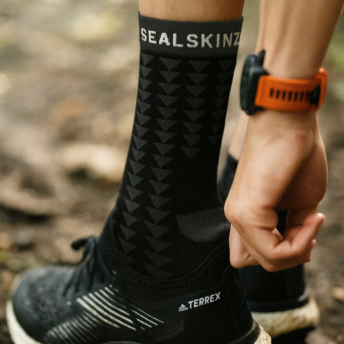 Black running socks with geometric pattern, mid-calf, SEAL SKINZ logo at cuff