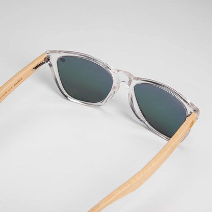 Polarised sunglasses with clear frame and dark mirrored lenses, angled view.
