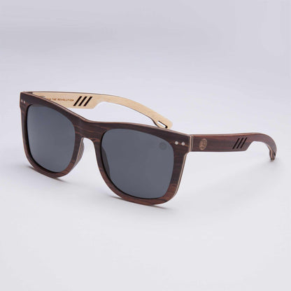 Brown wayfarer-style sunglasses with dark lenses and striped temple accents