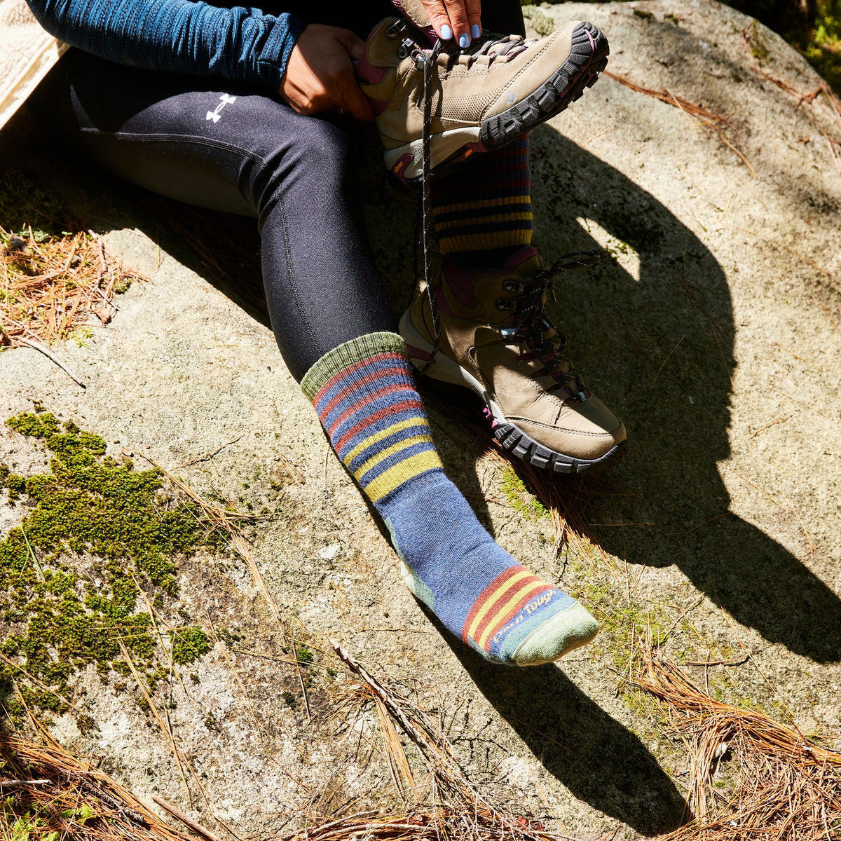 Midweight hiking merino wool socks in indigo blue with rainbow stripe bands