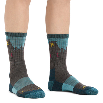 Pair of teal and charcoal merino hiking socks with bear motifs and red accents