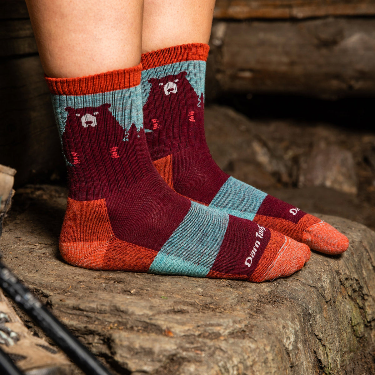 Ladies merino hiking crew socks in red, teal, and orange with bear pattern