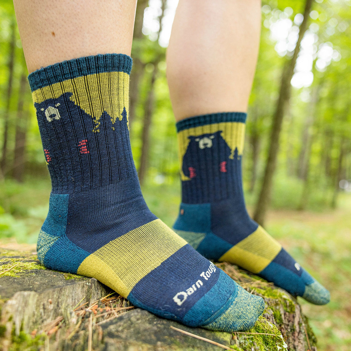 Merino hiking socks in navy and yellow with bear design and cushioned foot