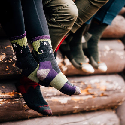 Ladies merino hiking crew socks in black with purple and olive bear pattern panels
