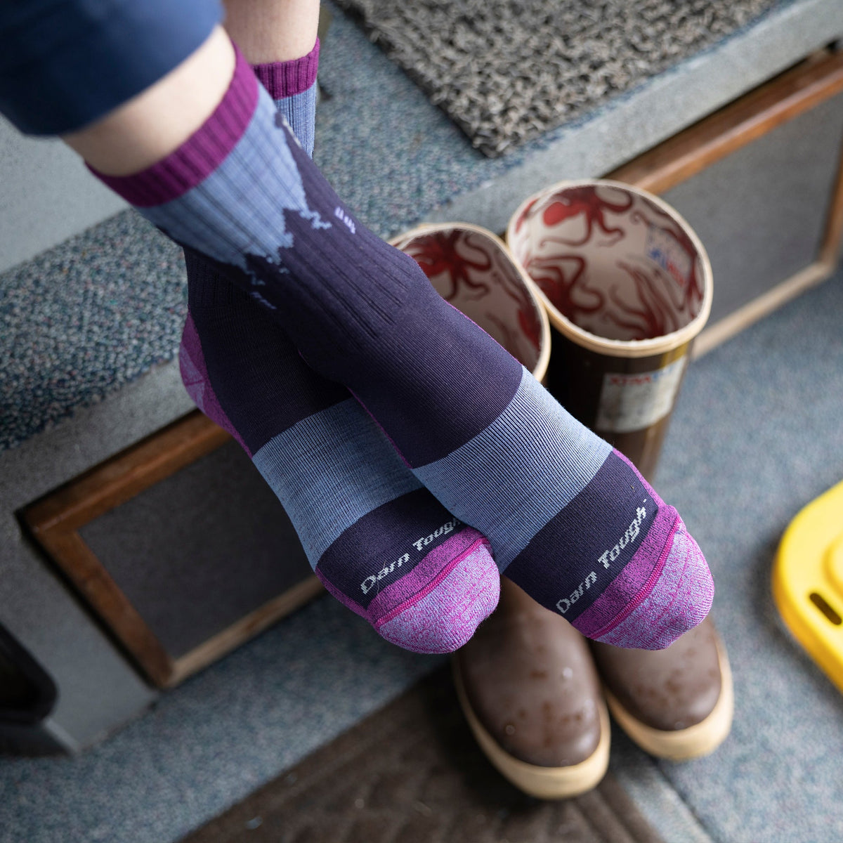 Ladies merino hiking crew socks in blue-gray and dark navy with bear motif and purple toe