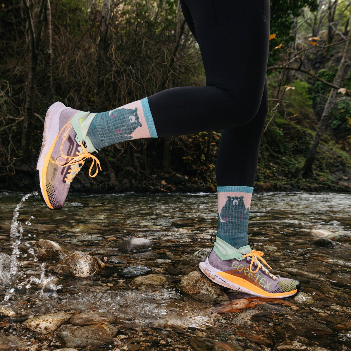 Merino hiking socks with teal legs, mint heel panels, and bear print