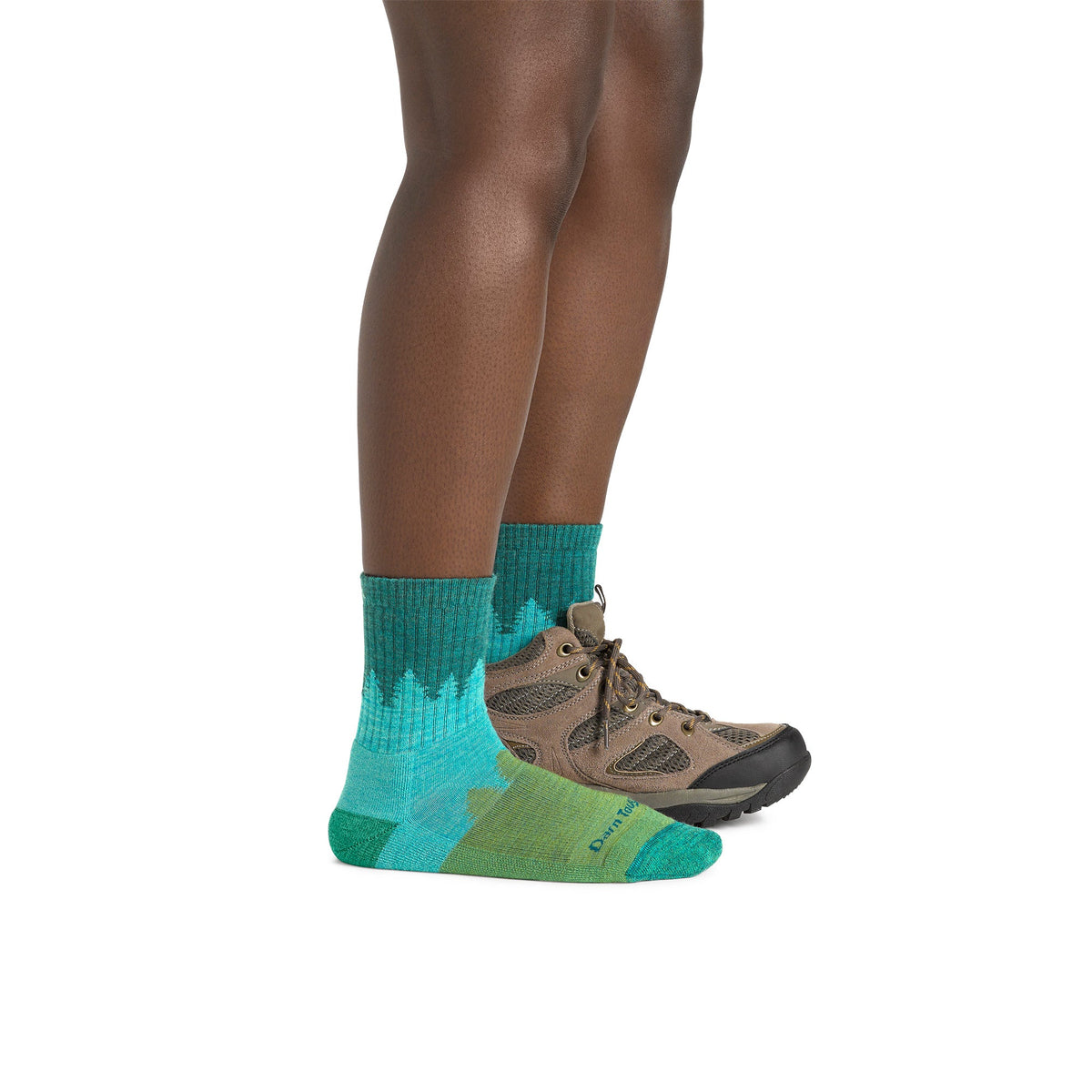 Ladies crew hiking socks in aqua blue worn with brown hiking shoes.