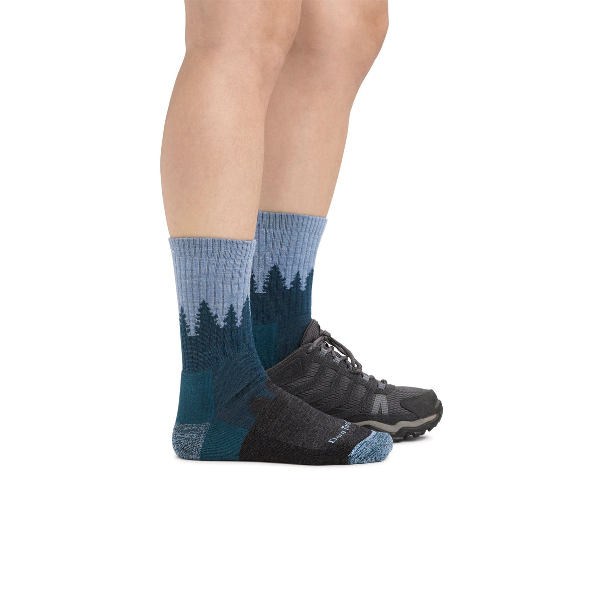 Blue mid-crew hiking sock with forest print on foot and dark toe