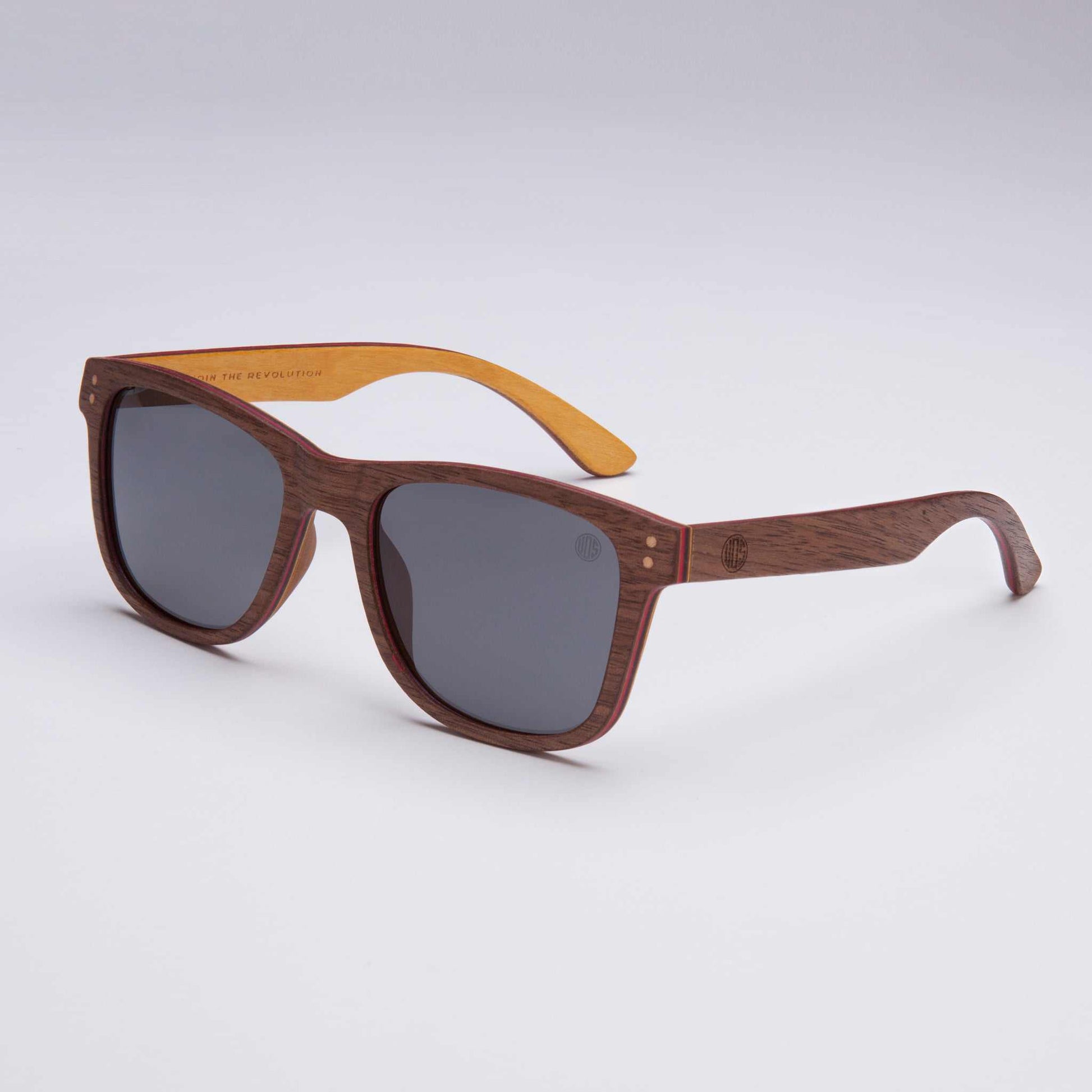 Wood-look sunglasses with dark gray lenses, brown frame and yellow temple tips