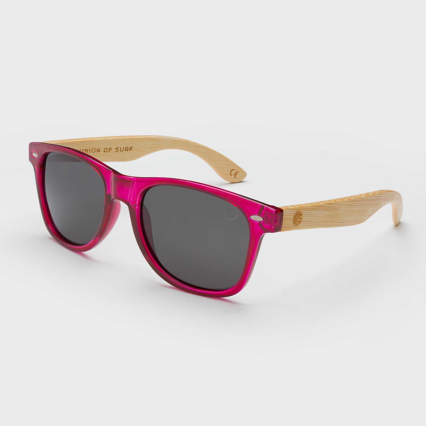 Pink cat-eye sunglasses with dark lenses and bamboo-look arms