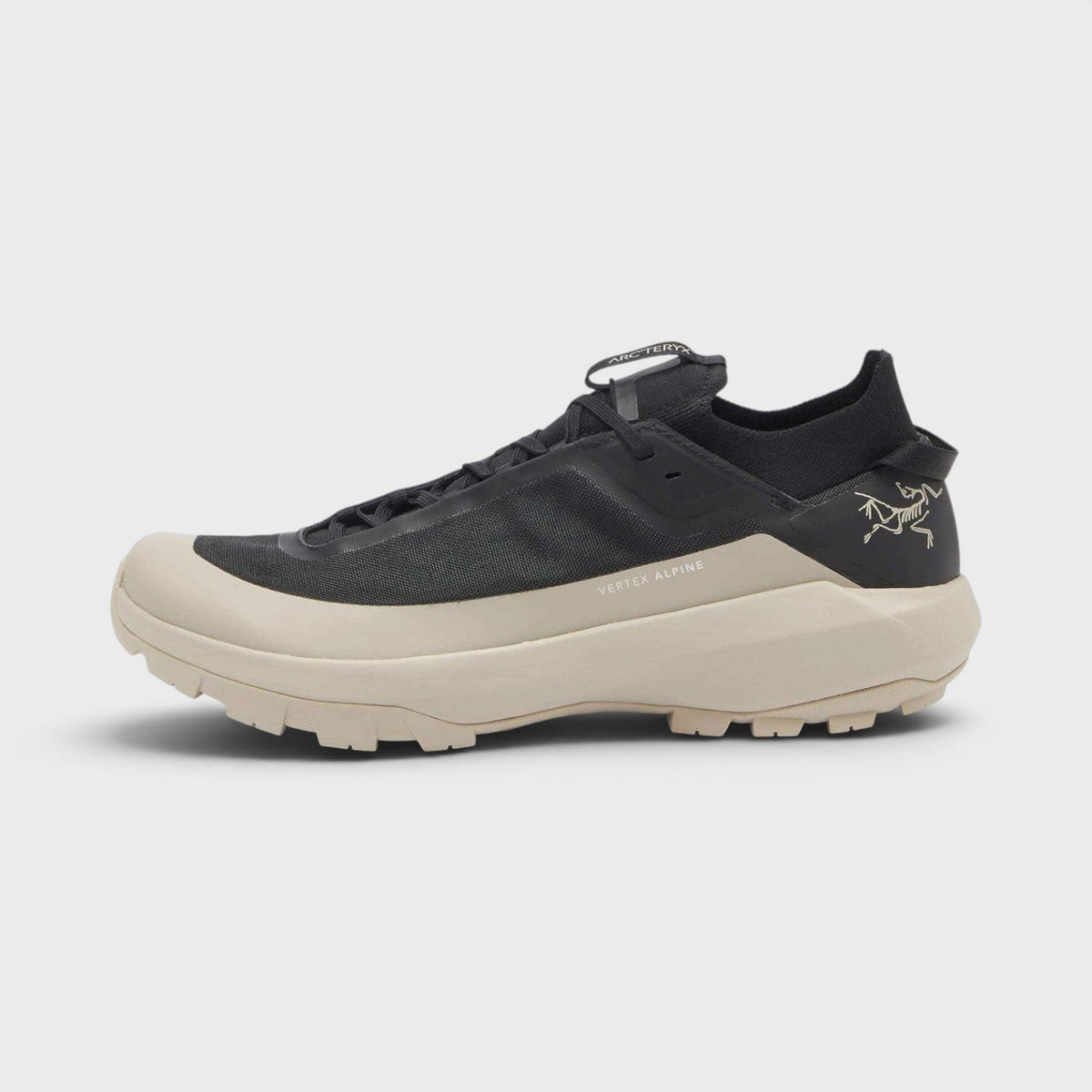 Black lace-up sneaker with beige sole and side rune logo detail, UK8.5.
