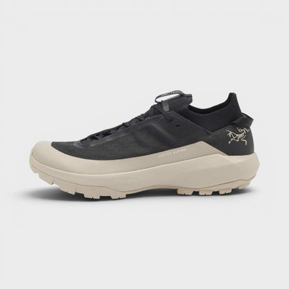 Black lace-up sneaker with beige sole and side rune logo detail, UK8.5.