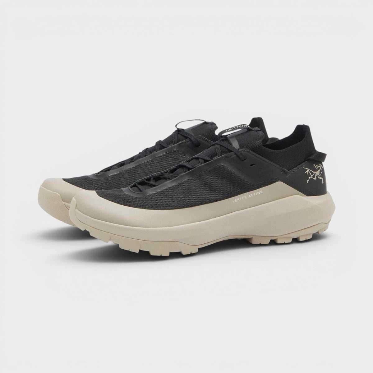Black lace-up sneakers with beige chunky sole and side rune logo, UK8.5.