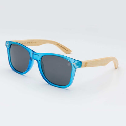 Sunglasses with blue acetate frames and dark lenses, light wood-look arms