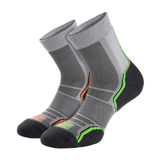 Pair of grey men’s trail socks with black mesh panels and neon green/orange trim