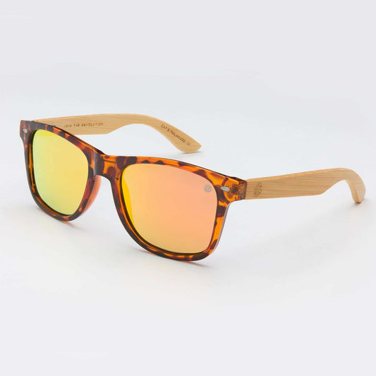 Sunglasses with tortoise acetate frames and amber tinted lenses, light wood-look arms
