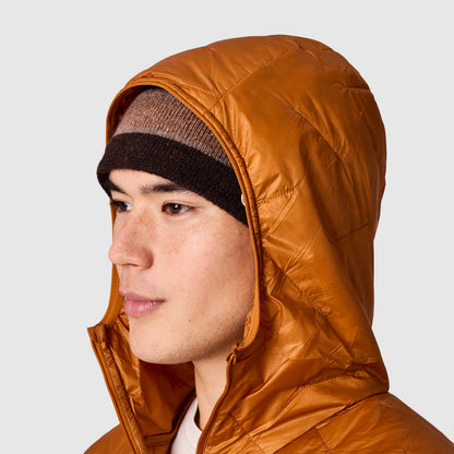 Orange hooded jacket close-up with dark knit beanie under the hood