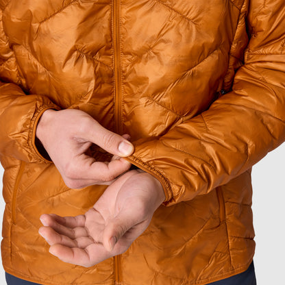 Orange quilted hoodie jacket close-up of zipper front and cuff