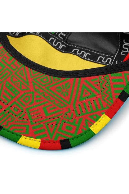 Brim close-up of technical cap with geometric green pattern, black edge, and red trim