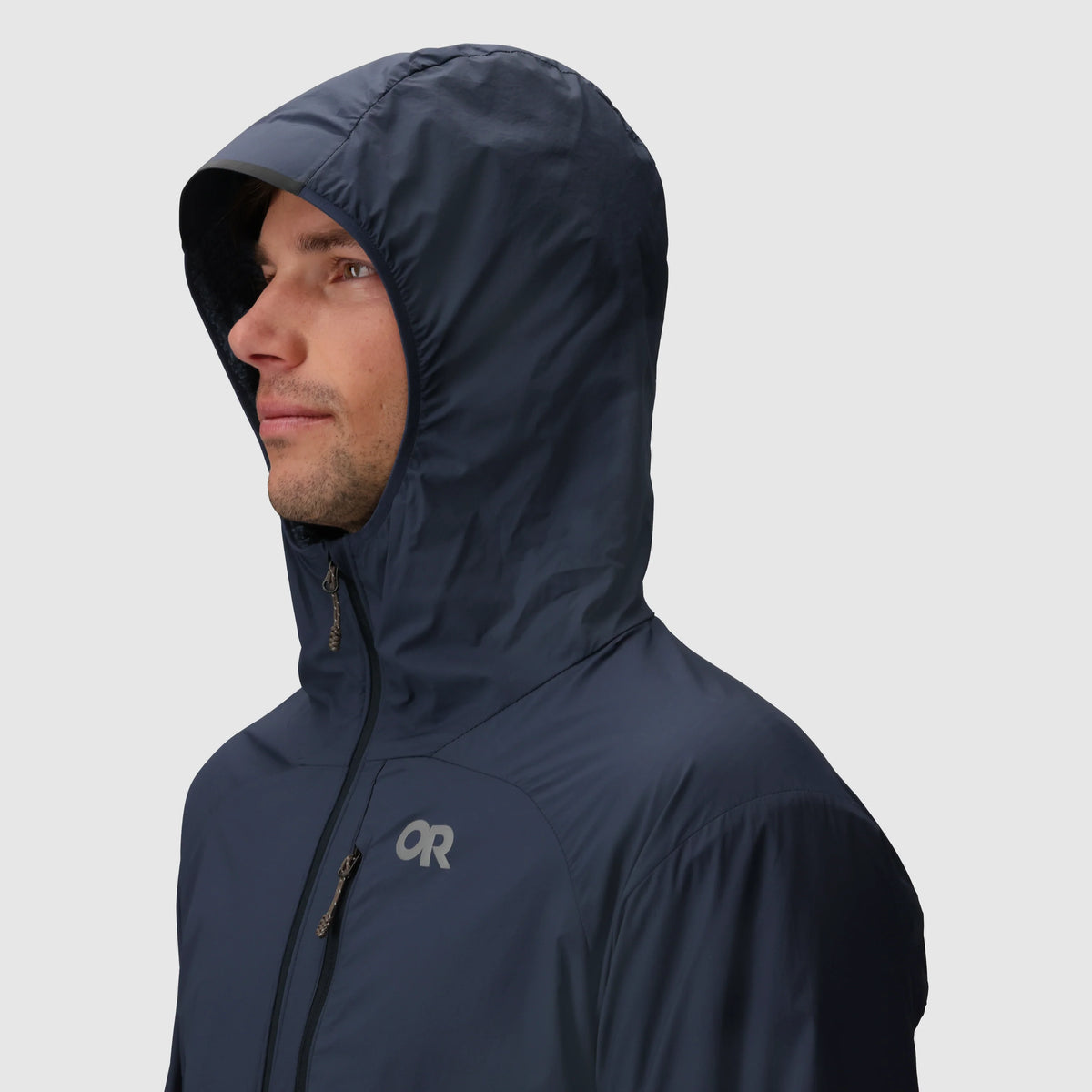 Navy hoodie shown with the hood up and a zippered chest pocket