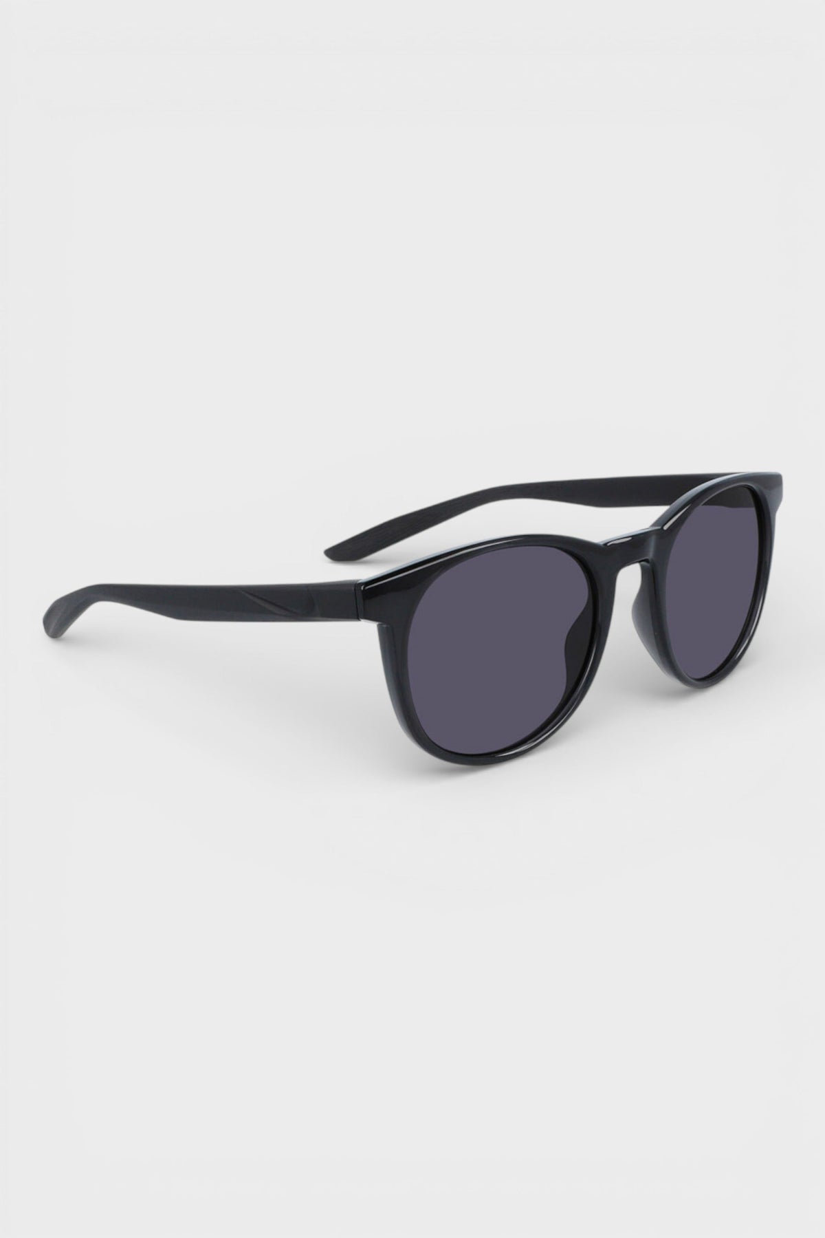 Nike sunglasses with dark lenses and black frame, angled profile view