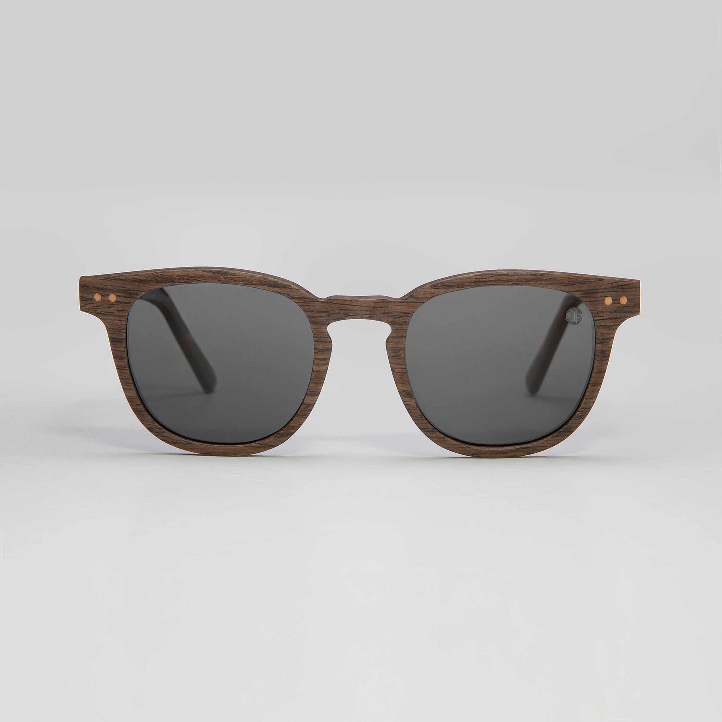 Walnut sunglasses with dark round lenses and tortoise-style temples