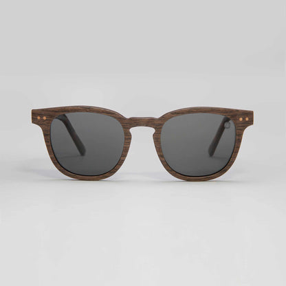 Walnut sunglasses with dark round lenses and tortoise-style temples