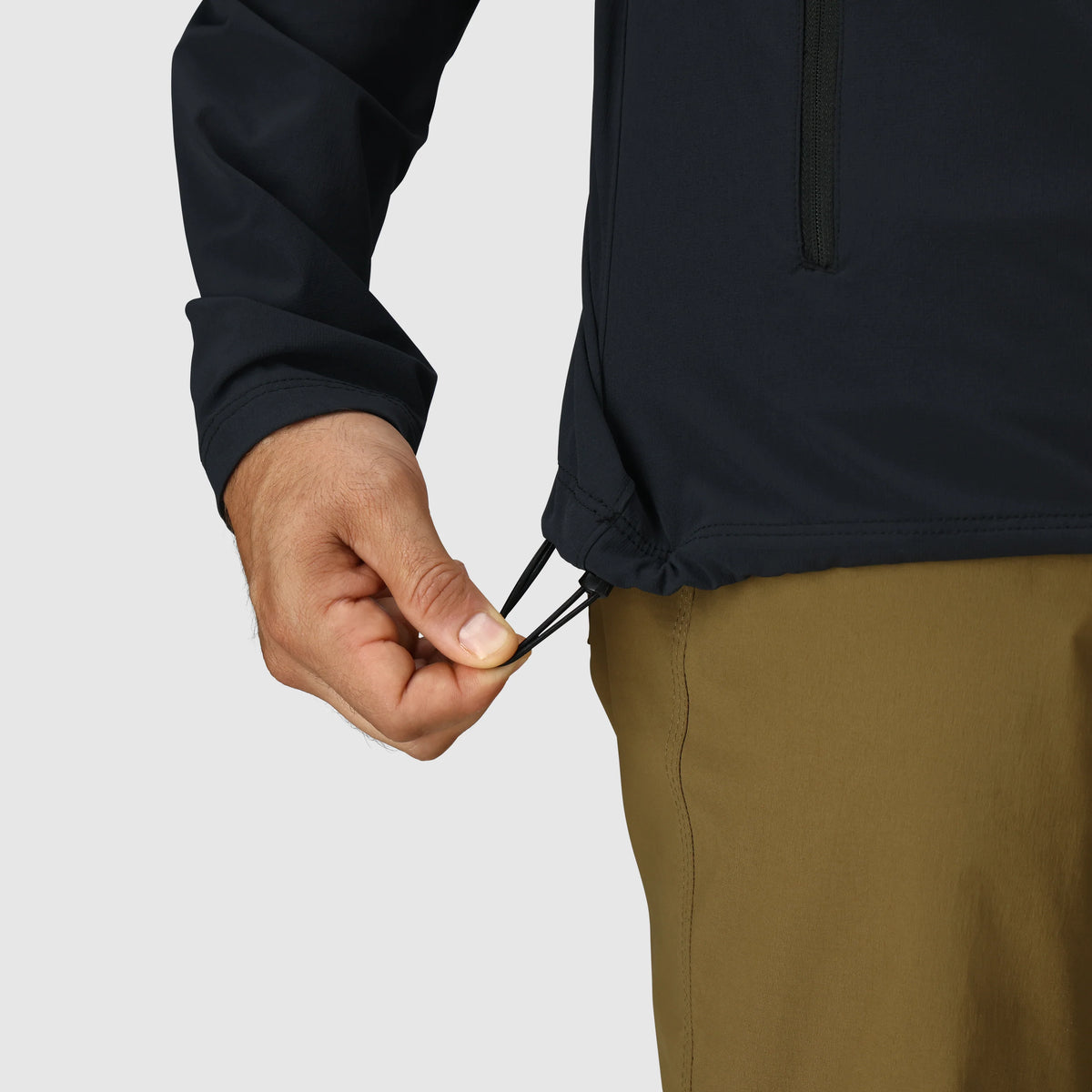 Men's dark softshell jacket with adjustable drawcord at the hem