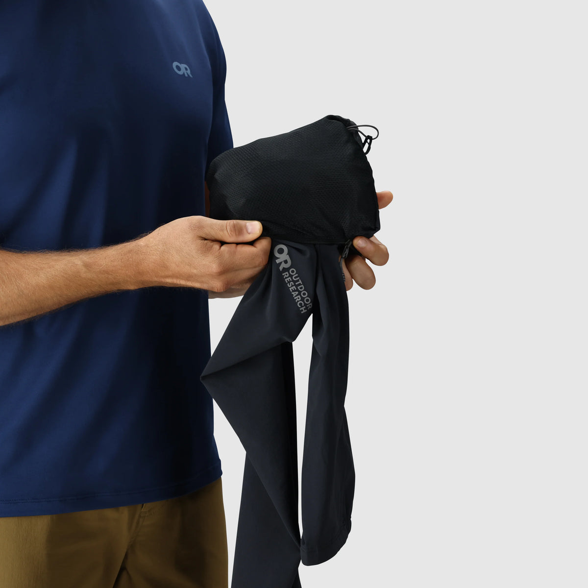 Men's softshell jacket packed into a compact bundle