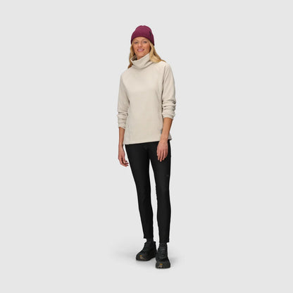Cream fleece cowl pullover with sleeves pushed up, worn with a knit beanie