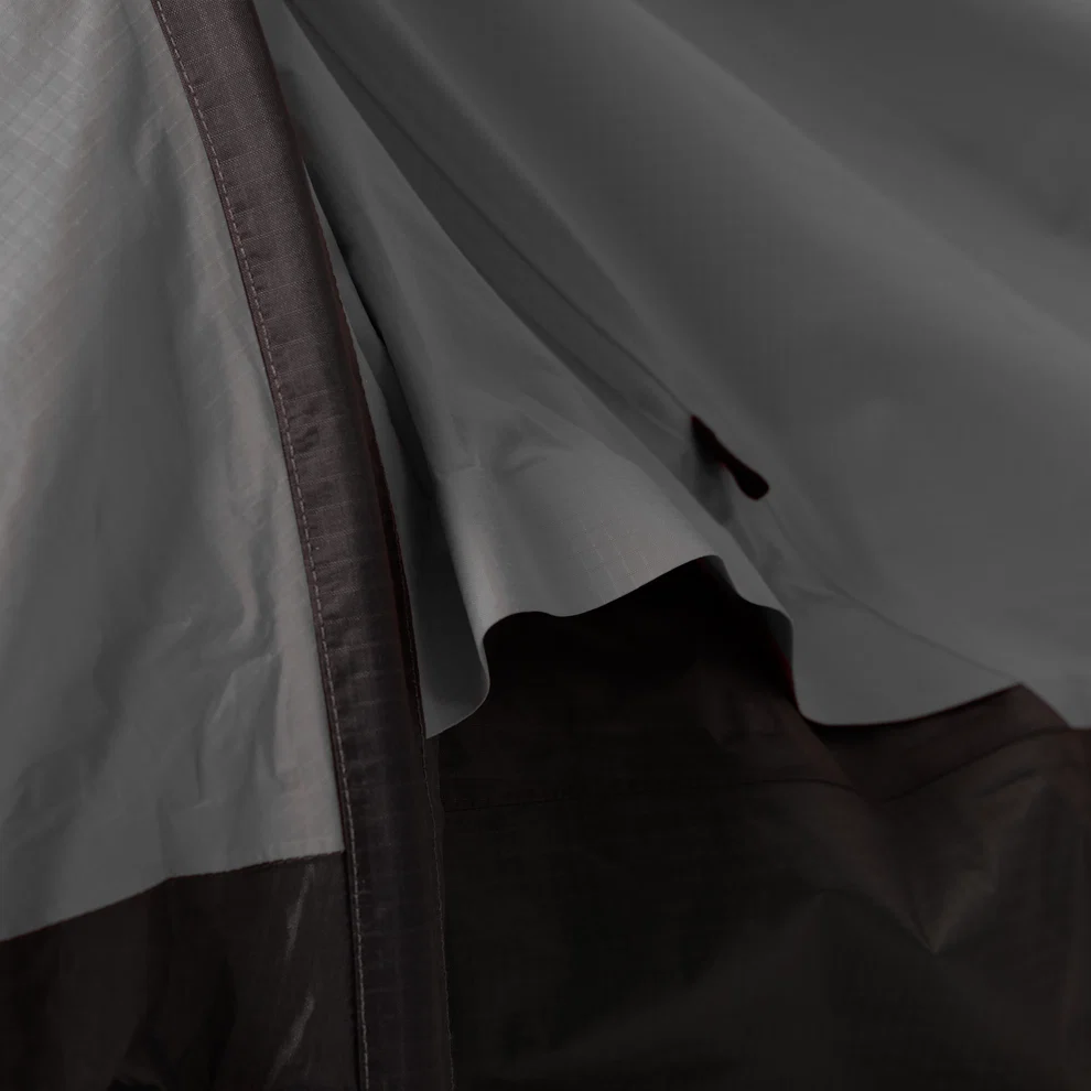 Gray bivy shelter close-up of the inner fabric and curved support pole