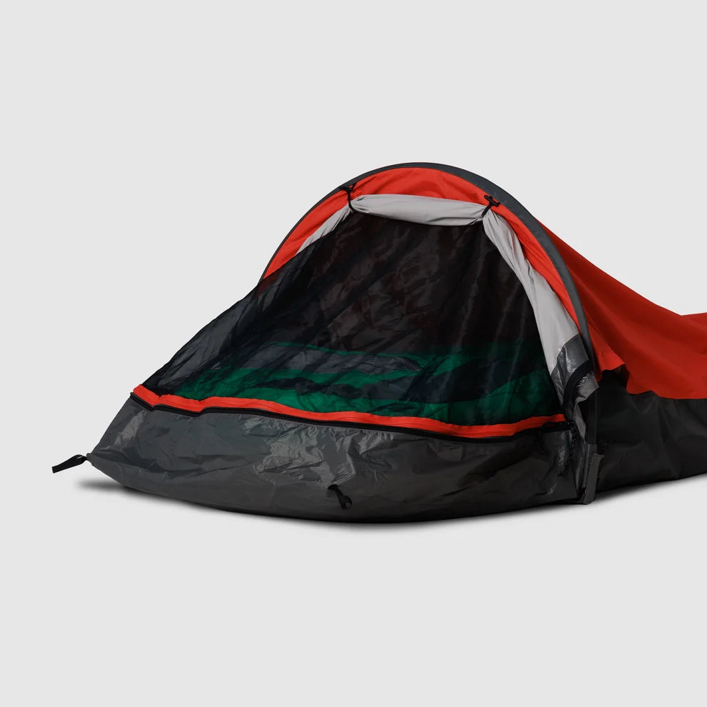 Red bivy shelter with its mesh face panel open