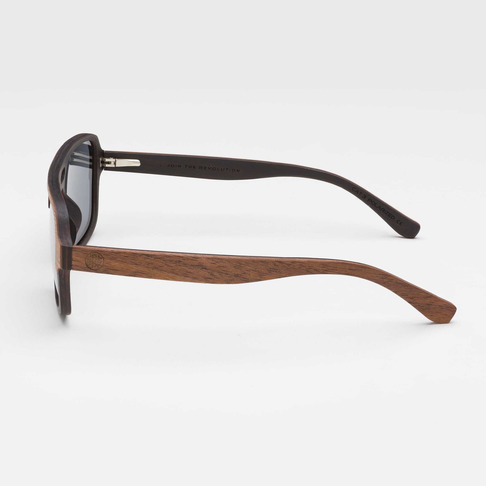 Walnut wood sunglasses profile view with dark gray lenses and tapered temples