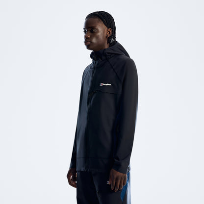 Person wearing a black jacket with a brand logo on a white background