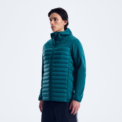 Person wearing a teal puffer jacket on a white background