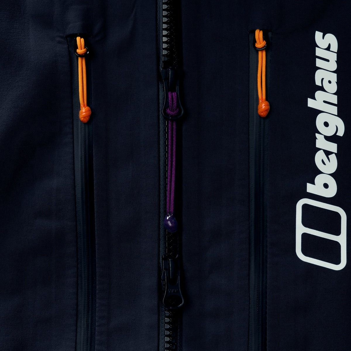 Black jacket chest close-up with full-length front zip and orange pull tabs
