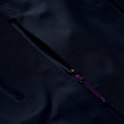 Black jacket fabric with diagonal purple zipper and pull tab