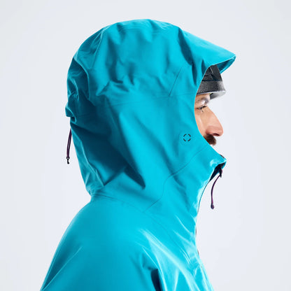 Blue hooded waterproof jacket with side vent and drawcords, profile close-up