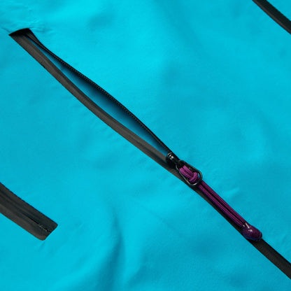 Black trim zipper tape with purple cord pull on blue waterproof jacket