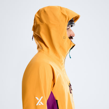 Orange hooded waterproof jacket side view with purple pocket panel and black trim
