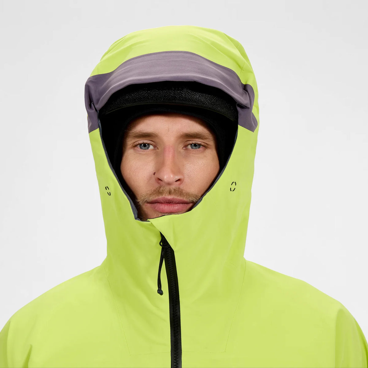 Men's neon yellow waterproof jacket hooded close-up, front zip and drawcord detail