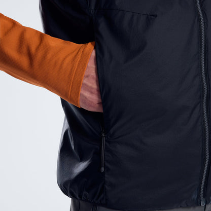 Reversible insulated gilet close-up: zip front and stitched panel detail.