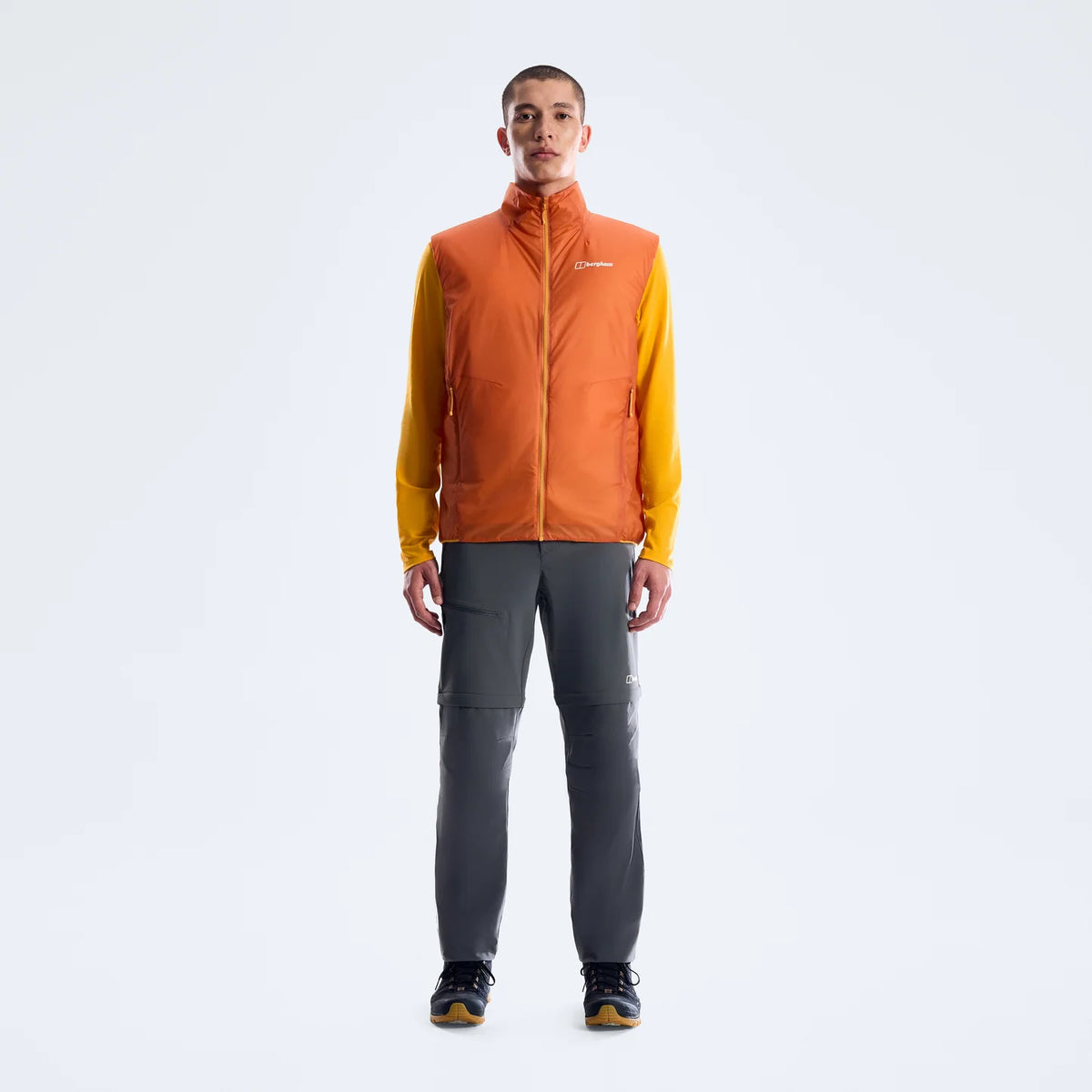 Hydroloft Elite reversible insulated gilet on model, bright orange sleeveless layer